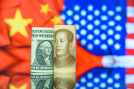 Trade tensions or trade wars between the US and China : Both American and Chinese banknotes prominently display the likenesses of historical figures, including George Washington and Mao Zedong.