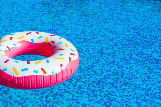 istock Dive into poolside delight with doughnut float. Concept of leisure time essentials 1722433563