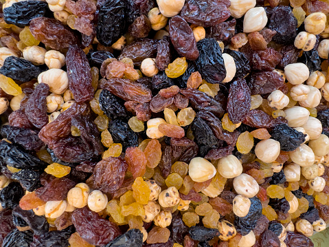 Raisins in a wooden spoon, close-up