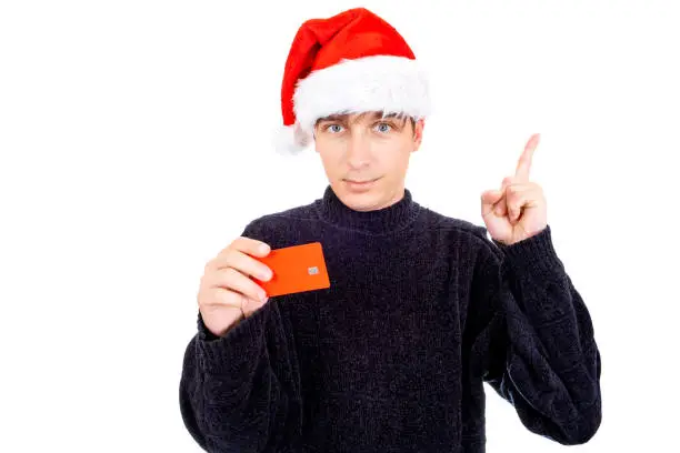 Young Man in Santa Hat with Empty Bank Card show Finger Up Isolated on the White Background