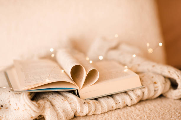istock Heart shaped paper book over xmas lights 1722439447