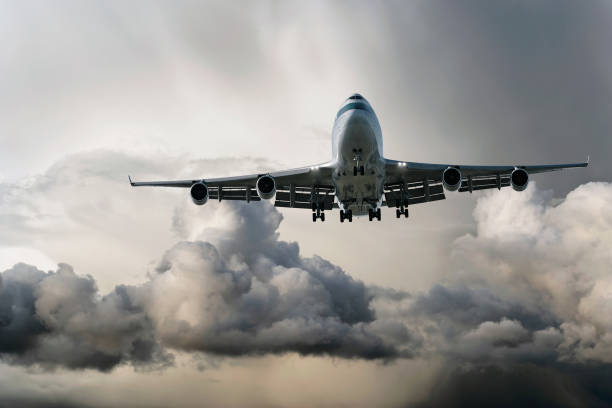 istock jumbo jet airplane landing in storm 172244395