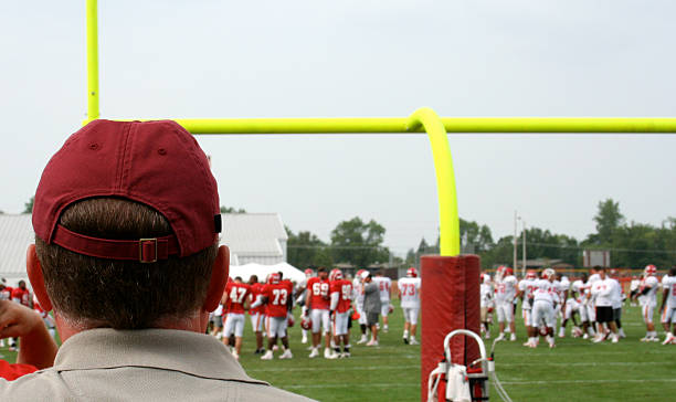 istock Coach Watches Football Kicking Practice 172245079