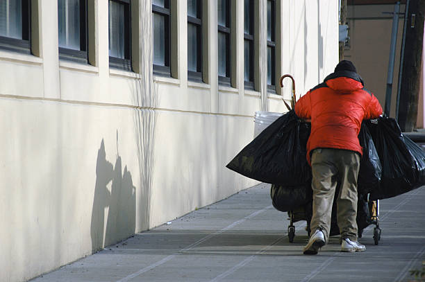 istock Homeless man with shopping cart 172245253
