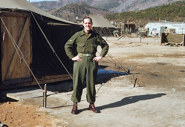Vintage photo: American G.I. "American G.I. poses in South Korea's Camp Casey during the Korean conflict, ca. 1953. Kodachrome scan. Because this is an authentic heirloom photo, the quality is not as high as a contemporary photograph." army soldier photos stock pictures, royalty-free photos & images