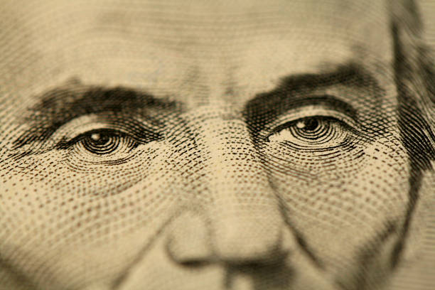 Mr Lincoln's eyes Macroshot of a five dollar bill five dollar bill stock pictures, royalty-free photos & images