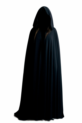 Female figure in black cape.