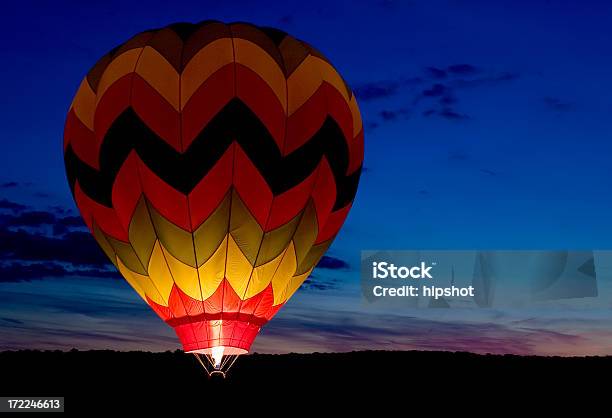 Striped Balloon Glow At Sunset Stock Photo - Download Image Now - Hot Air Balloon, Glowing, Night