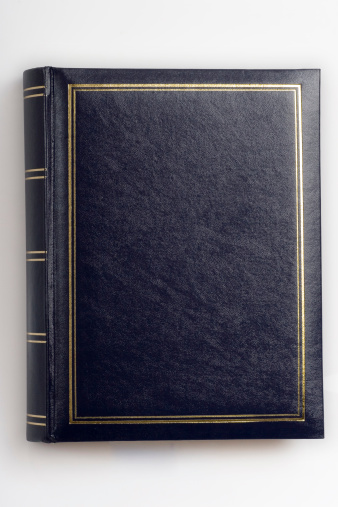 Black leather covered thick book with clipping path