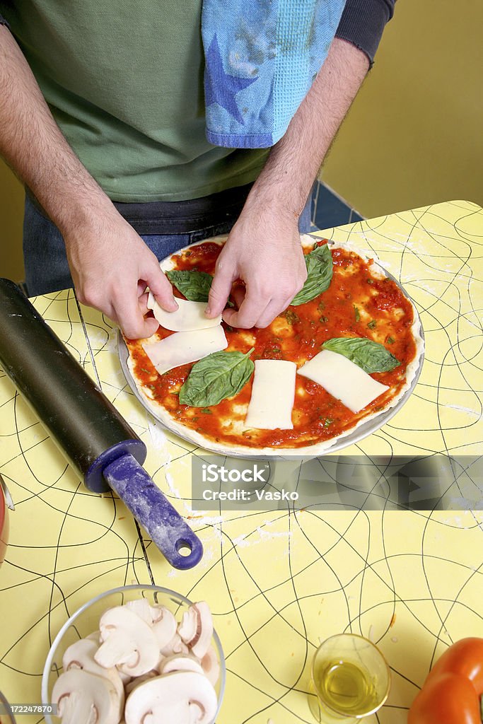 Pizza Preparation Series 2 Picture of pizza being put together. Arranging Stock Photo