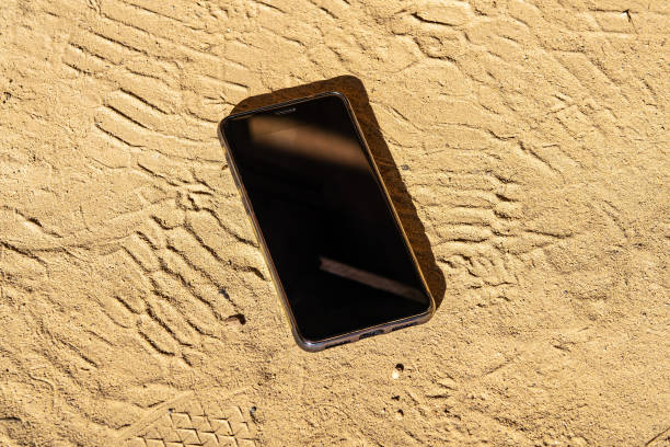 Lost Mobile Phone on the Ground at the Street closeup