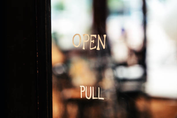 istock View through window of open sign in shop 1722481241