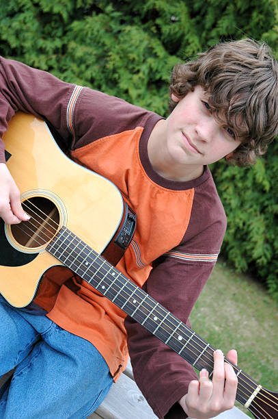 istock Teen Playing Guitar 172248523