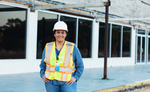 istock Hispanic female construction worker at renovation site 1722485463