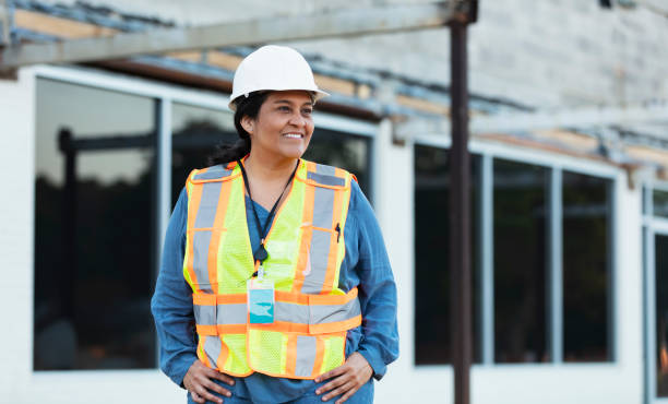 istock Hispanic female construction worker in front of building 1722485465