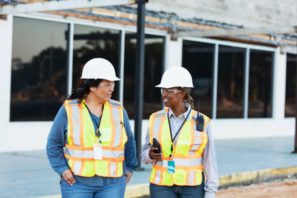 istock Two multiracial female construction workers at job site 1722485980