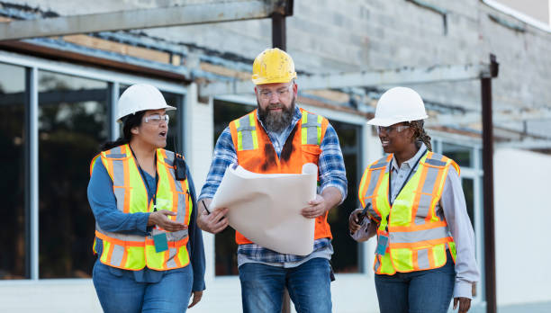 istock Diverse team of three construction workers at job site 1722485982