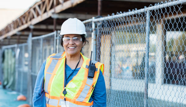 Female Hispanic construction worker standing outdoors