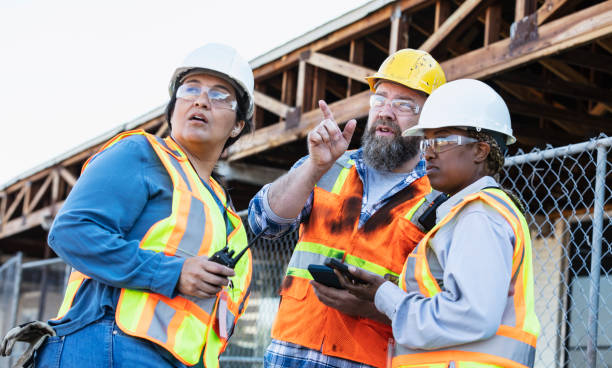 istock Multiracial group of workers meeting at construction site 1722486022