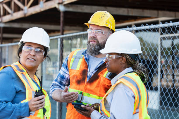 istock Multiracial group of workers meeting at construction site 1722486026
