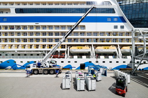 Hamburg, Germany - June 4, 2017: Luggage being loaded into cruise ship ‘AIDAsol’ at Cruise Center Steinwerder