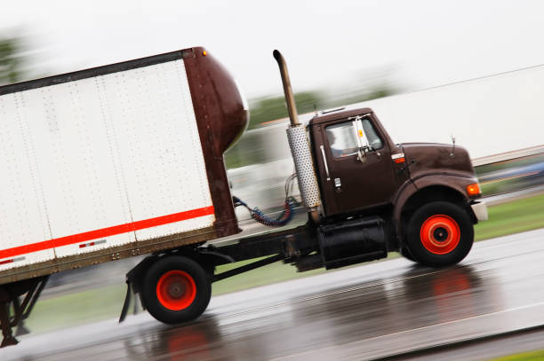 istock Black cargo truck speeding in the road 172249052