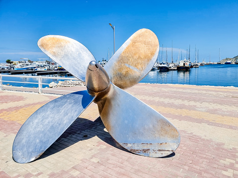 Colombia, Santa Marta, July 10, 2023, large metal naval propeller on the quay of the port