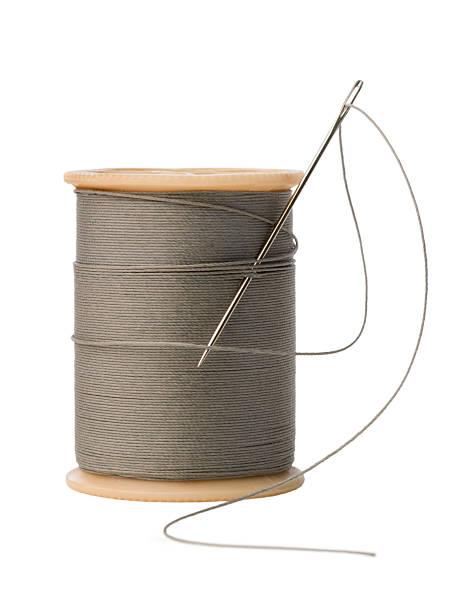istock Sewing Needle and Spool of Thread Isolated on White Background 172249404