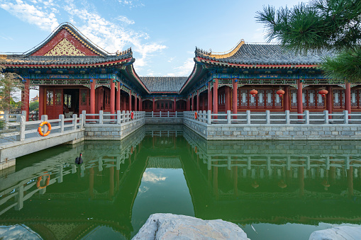 Chinese style garden scenery, ancient architectural attic on the lake