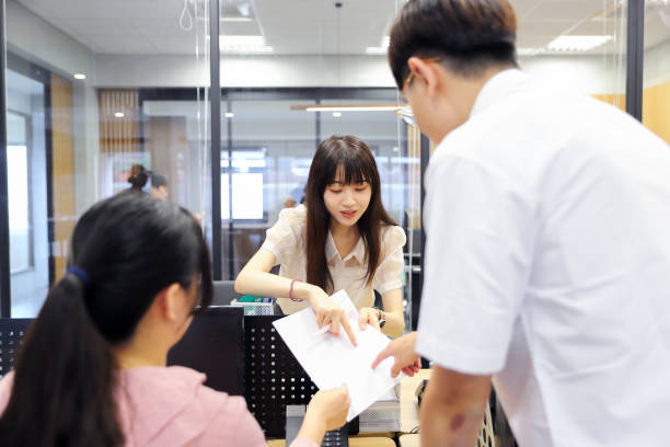 istock Asian young office workers discussing work content in the office. 1722496137