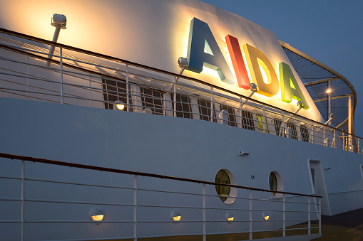 Elbe, Germany - June 4, 2017: illuminated funnel of cruise ship ‘AIDAsol’