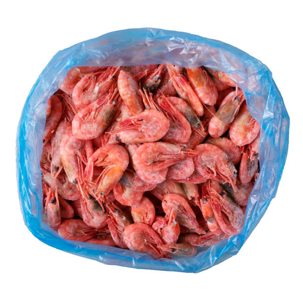 istock Frozen boiled shrimps in a plastic bag isolated on white 1722496348