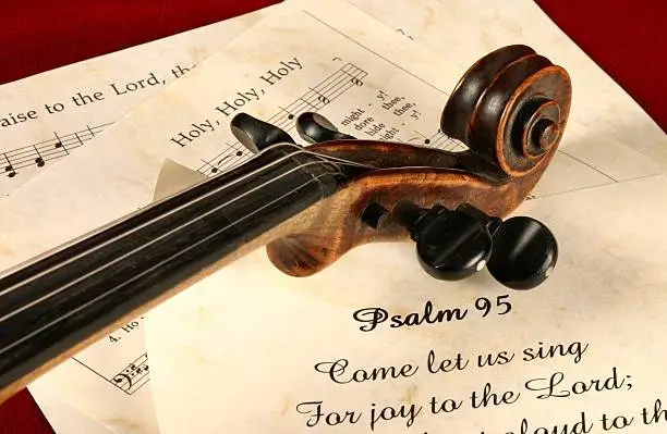 Part of Psalm 95 Bible scripture with violin and 2 hymns. I have several images using the violin and songs. Horizontal Christian image.