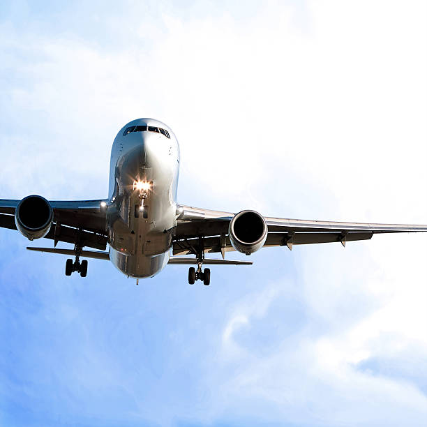 istock jet airplane landing in bright sky 172249668