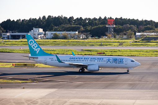 Tokyo, Japan - September 18, 2023 : Greater Bay Airlines Boeing 737 at Narita International Airport in Japan.