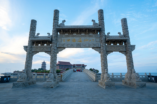 Memorial archway at the entrance of the Eight Immortals Crossing the Sea, Yantai, Shandong, China