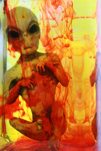 istock Alien in a solution of yellow and red liquid 172249854