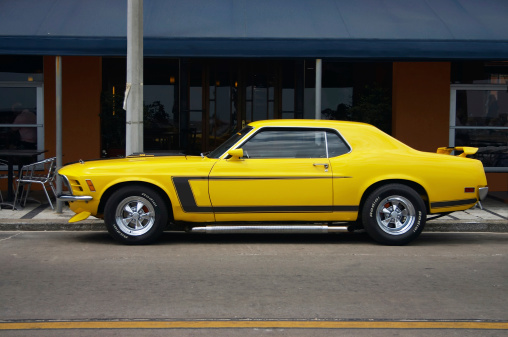 Yellow mustang parked. Includes clipping path to isolate from bakcground.Cars and wheels and racing stuff