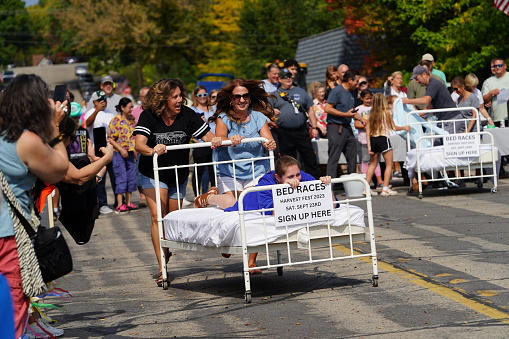 Green Lake, Wisconsin USA - September 23rd, 2023: Community members enjoyed a family event of bed racing on the streets of Green Lake.