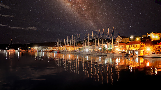 Sali harbor with sailing boats at night. Croatia. Adriatic. Mediterranean Sea. Konati.