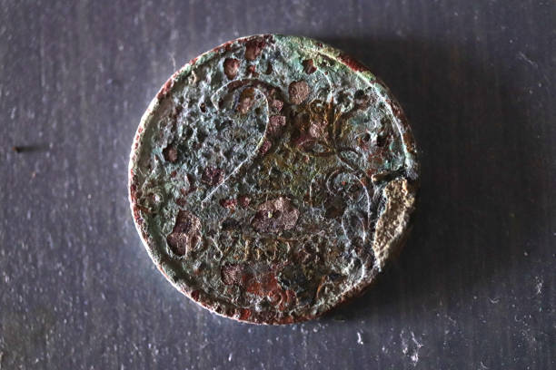 istock Rusty two ruble coin on a white painted wooden surface 1722501985