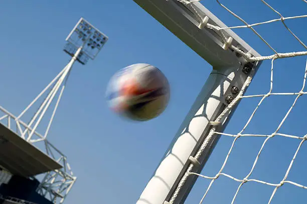 A Soccer ball heads for goal