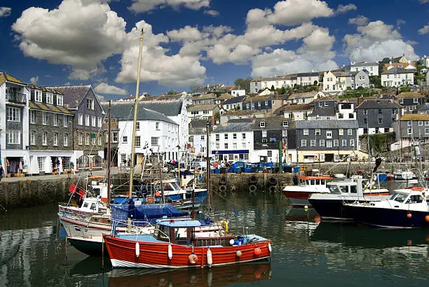 "Mevagissey fishing village with boats in the harbour, Cornwall, England"