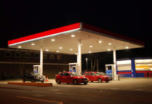 A filling, gas, or petrol station at night, Kent, England
