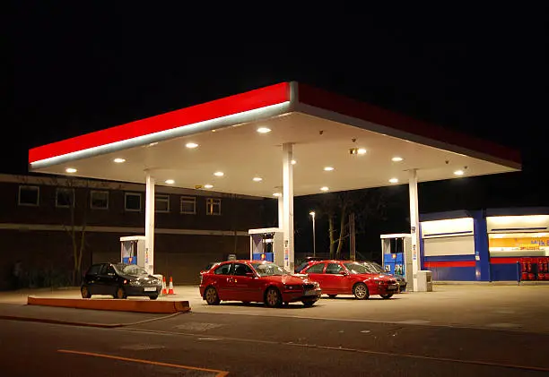 A filling, gas, or petrol station at night, Kent, England