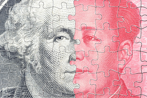 A complex jigsaw puzzle featuring faces of George Washington and Mao Zedong symbolizes the intricate trade war conflict and tension between USA and China, specifically in the realm of semiconductor.