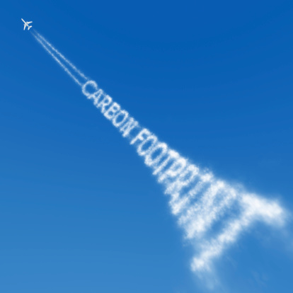 The buzzword of environmental politics is here illustrated as the writing on the contrail of a jet plane.See all my