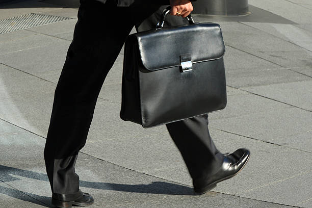 istock Businessmen walking, holding briefcase, low section 172251335