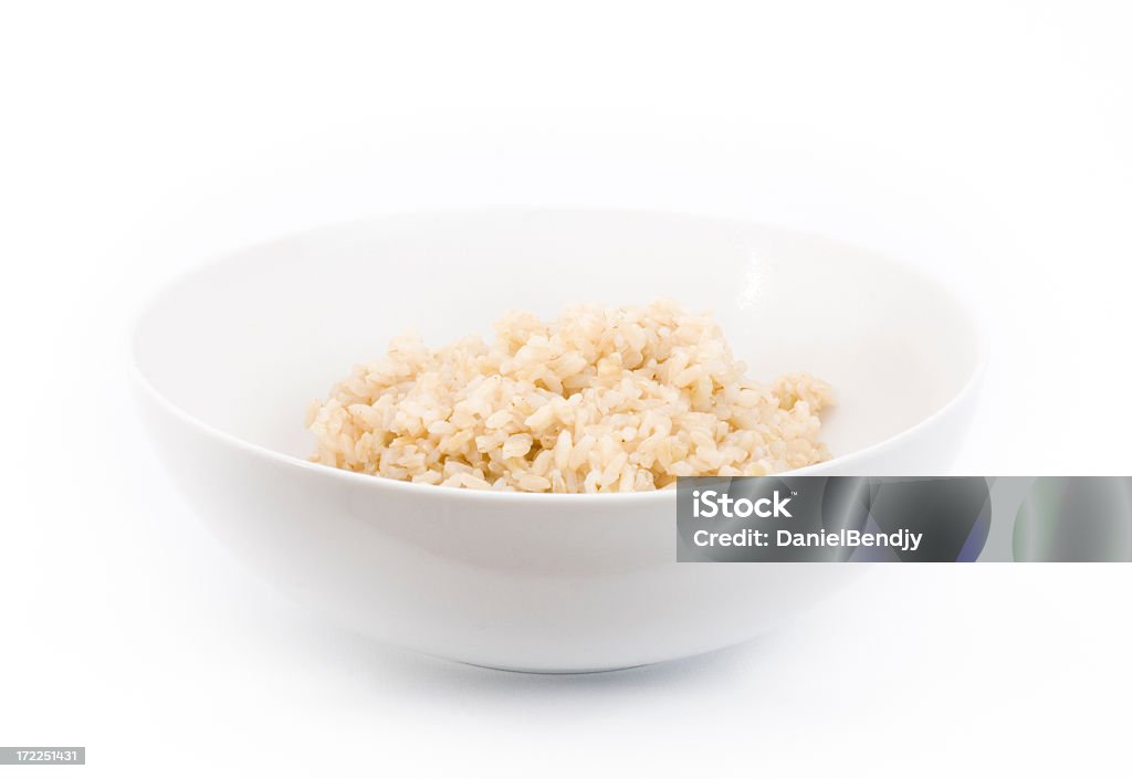 Bowl Of Rice Bowl of rice high key. Brown Rice Stock Photo