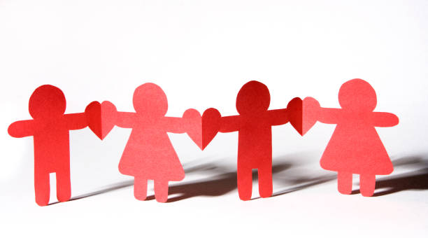 Paper chain of four children/people holding hearts. Alternating stylized girls and boys. Similar: